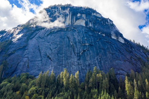 Massive granite walls, popular with local rock climbers, tower thousands of feet into the air in the Eldred Valley.