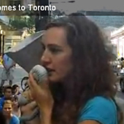 Zoe Miles speaking to a crowd of support during an Avatar flash mob in downtown Toronto to help protect BC's endangered ancient forests.