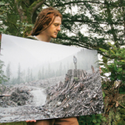 AFA photographer TJ Watt shows a print of his photo of a man on a stump in the Gordon River valley that won first place in a Outdoor Photography Canada magazine photo contest.