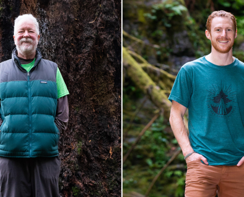 A man with grey hair and a beard stands in front of a massive old-growth tree wearing a puffy Patagonia vest and neon green t-shirt. Beside him on the right is a photo of another man with red hair and a beard wearing a teal Ancient Forest Alliance t-shirt, also standing in an old-growth forest.
